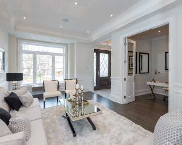 Furnished living room by Black Pearl custom homes design